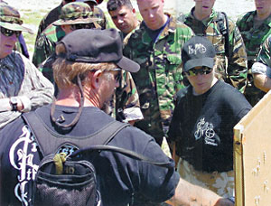 Debriefing student’s experiments with different mediums, ammunition, ranges and angles.