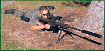 Ralph Garay of the Los Angeles County Sheriff's Department Special Enforcement Bureau Special Weapons Team with .50 BMG-caliber Barrett M82A1 rifle equipped with Tac Ops Clandestine 50 sound suppressor.
