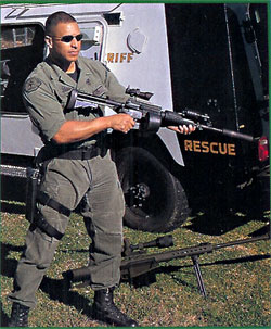 Ralph Garay with modified Colt AR-15 (selective fire, M4 modification) equipped with Tac Ops 556 sound suppressor.